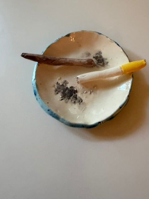 Ceramic ashtray with joint and cigarette